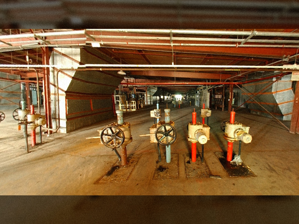 K-27 Operating Floor with unit control valves in foreground. Red valves are for enriched piping and blue are for depleted piping.