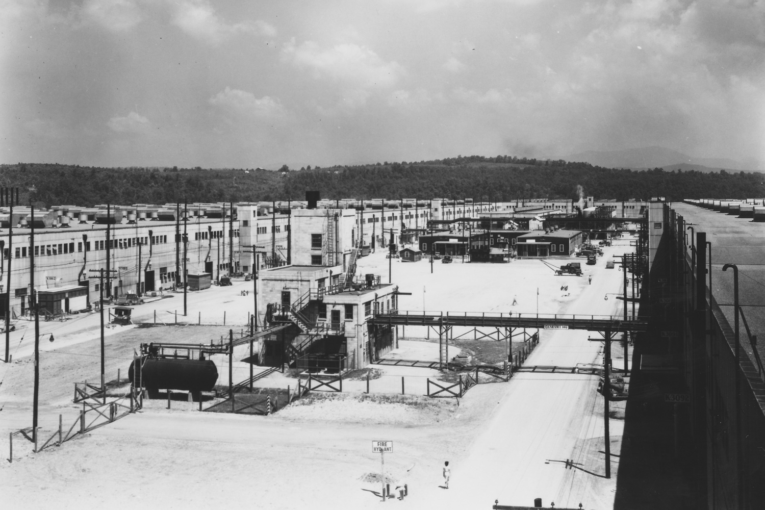 K-25 Building Court (open area inside the 'U') looking northwest with K-101 Feed Purification Building in foreground